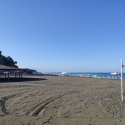 Foto di Ureki beach con dritto e lungo