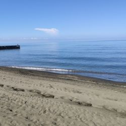 Foto di Ureki Nature beach con una superficie del acqua cristallina