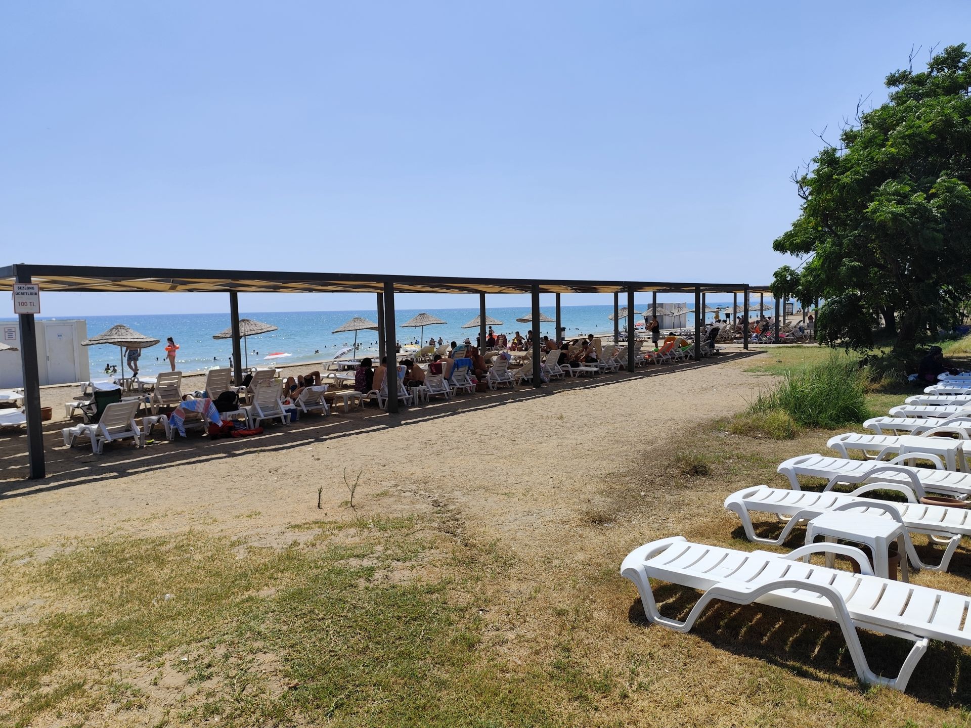 Foto di Belek Public beach con una superficie del sabbia scura